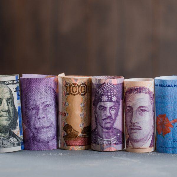 rolled-banknotes-plaster-wooden-table